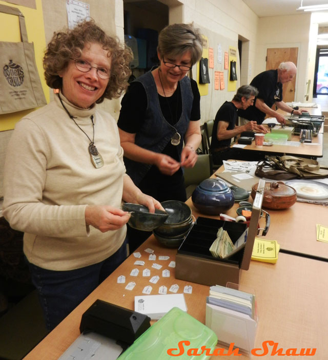 Potters check you out at the Greater Lansing Potters Guild sale