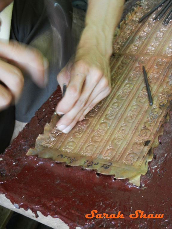 Creating an embossed design with silver at Artisans Angkor