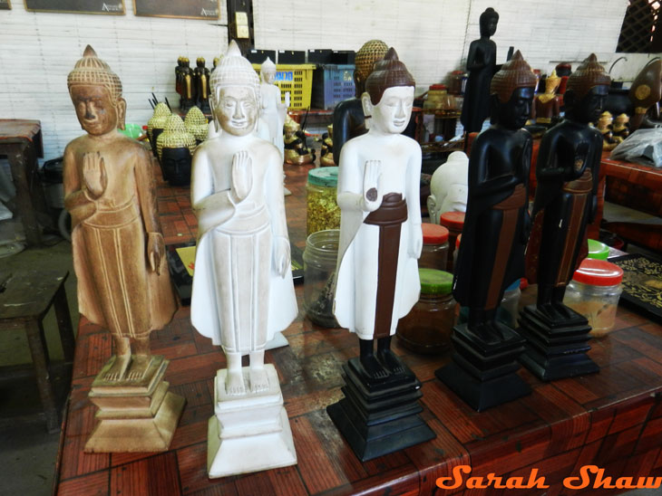 Stages of finished a statue of Buddha at Artisans Angkor