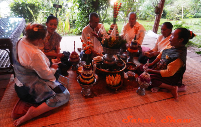 Sharing food at the end of the Baci Ceremony in Laos