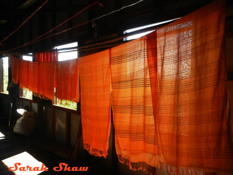 Freshly dyed textiles hang to dry at Khit Sunn Yin in Myanmar