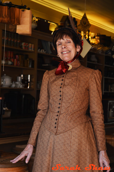 Shopkeeper in period dress