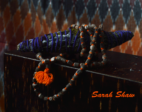 Smudge stick and mala prayer beads