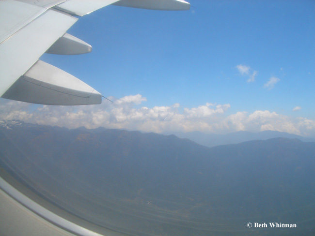 Airplane wing and himalayas