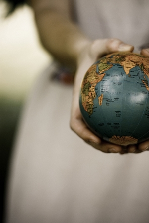 Woman Holding Globe