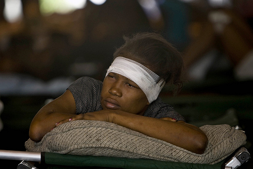 Haitian woman with head bandage