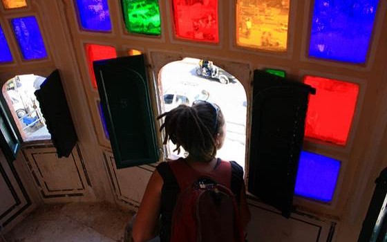Tourist Looking Through Hawa Mahal Window