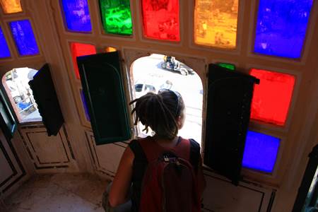 Tourist Looking Through Hawa Mahal Window