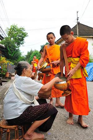 Lao Elderly Lady Giving Alms to Monks