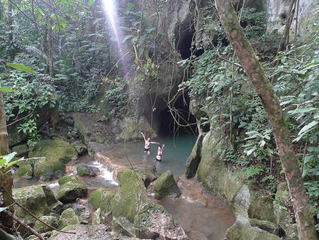 Swimming at Actun Tunichil Muknal