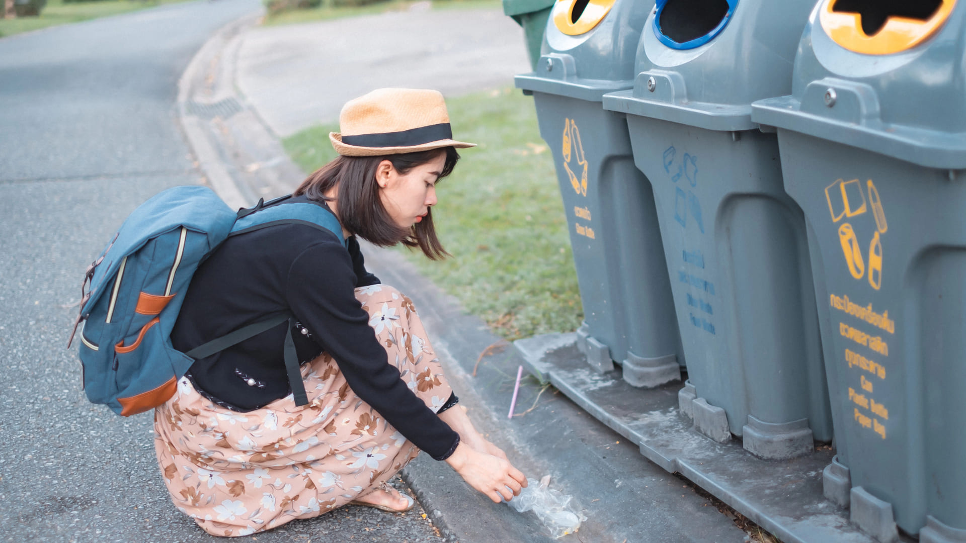 Tourist picking up trash